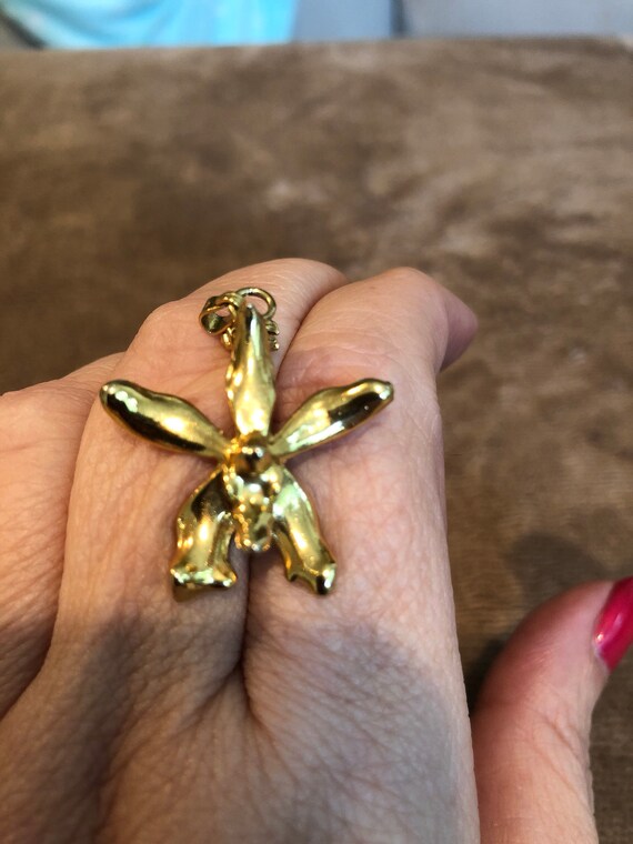 Gold iris pendant