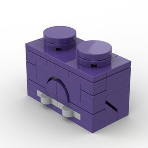 Könnte beinhalten: Ein lila LEGO-Stein mit einem eingebauten Ofen und zwei runden Knöpfen oben.