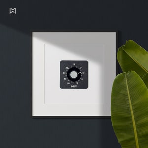 May include: A black and white knob with numbers and the word "INPUT" on a white background in a black frame.