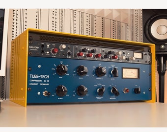 May include: A yellow and blue audio mixing console with the text "SHELFORD CHANNEL" and "TUBE-TECH COMPRESSOR CL 1B LYDKRAFT DENMARK" on the front.