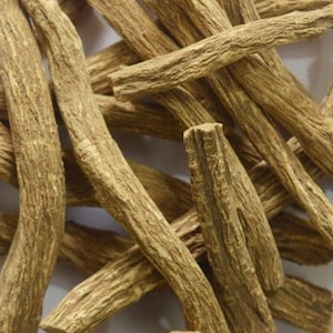 May include: A pile of dried, light brown, woody roots. The roots are long and thin, with a rough texture.