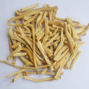 May include: A pile of dried, light brown, thin, and long sticks. The sticks are arranged in a random pattern and are all about the same size.