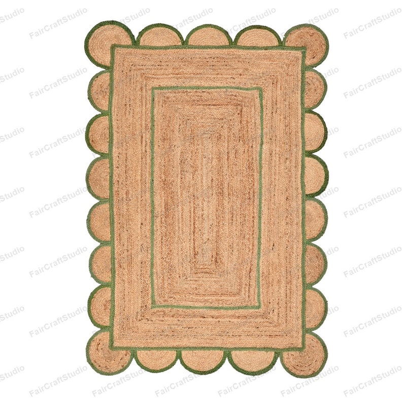 May include: A rectangular jute rug with a green border and a scalloped edge. The rug has a double border with a smaller green border inside the larger green border.