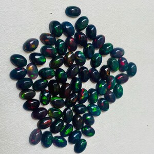 Gema ovalada de ópalo negro natural AAA, piedras sueltas de calidad AAA+. imagen 2