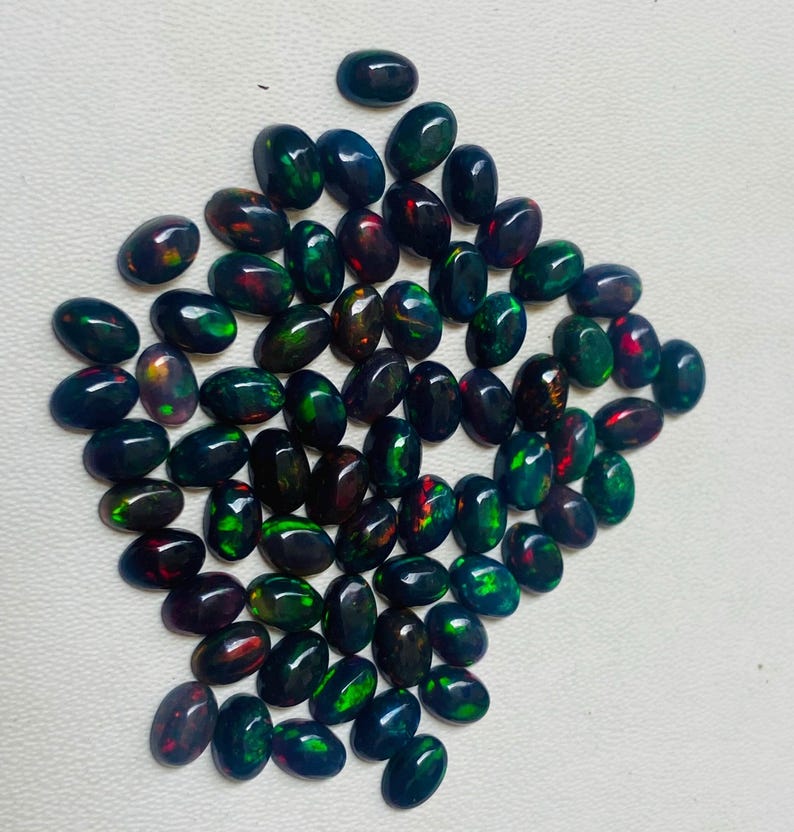 Gema ovalada de ópalo negro natural AAA, piedras sueltas de calidad AAA+. imagen 2