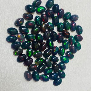 Gema ovalada de ópalo negro natural AAA, piedras sueltas de calidad AAA+. imagen 3