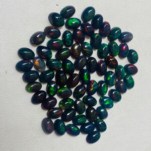 Gema ovalada de ópalo negro natural AAA, piedras sueltas de calidad AAA+. imagen 7