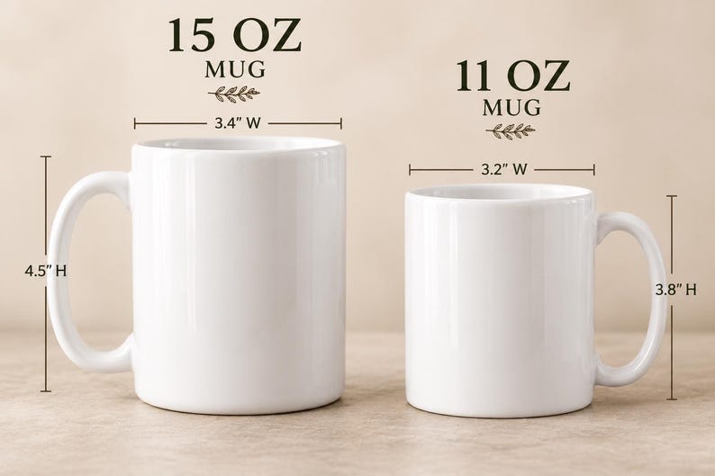 May include: Two white ceramic mugs shown side-by-side. The left mug is labeled 15 OZ MUG, measuring 4.5 inches high and 3.4 inches wide. The right mug is labeled 11 OZ MUG, measuring 3.8 inches high and 3.2 inches wide. Both have handles.