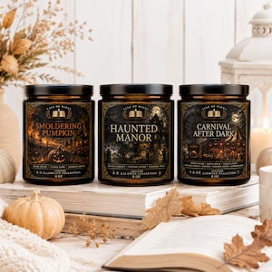 Halloween After Dark luxury soy candle collection displayed in a cozy autumn home with amber glass jars, vintage books, white pumpkins, knit blanket, lantern, and illustrated Smoldering Pumpkin, Haunted Manor, and Carnival After Dark labels by Tale of Wick