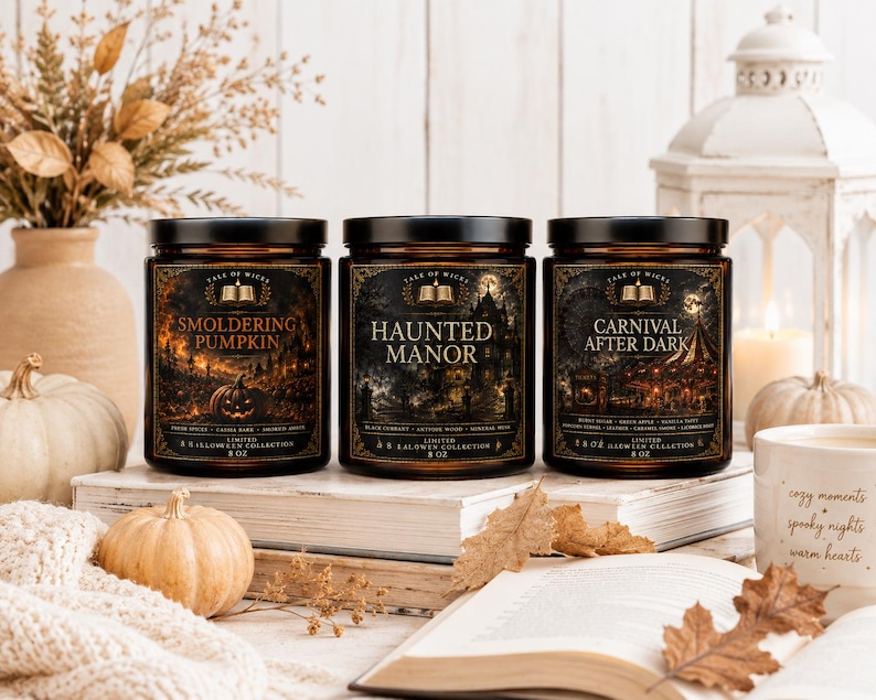 Halloween After Dark luxury soy candle collection displayed in a cozy autumn home with amber glass jars, vintage books, white pumpkins, knit blanket, lantern, and illustrated Smoldering Pumpkin, Haunted Manor, and Carnival After Dark labels by Tale of Wick