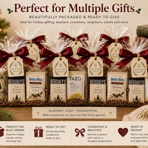 Heritage Christmas mug gift sets wrapped in clear cello with burgundy satin bows, Hershey’s chocolate and a choice of Swiss Miss cocoa or Tazo tea, shown ready for coworker, teacher, neighbor and bulk holiday gifting.