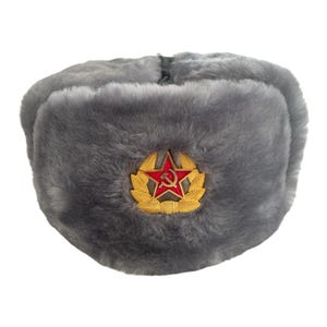 May include: A grey faux fur ushanka hat with a gold star and hammer and sickle emblem.