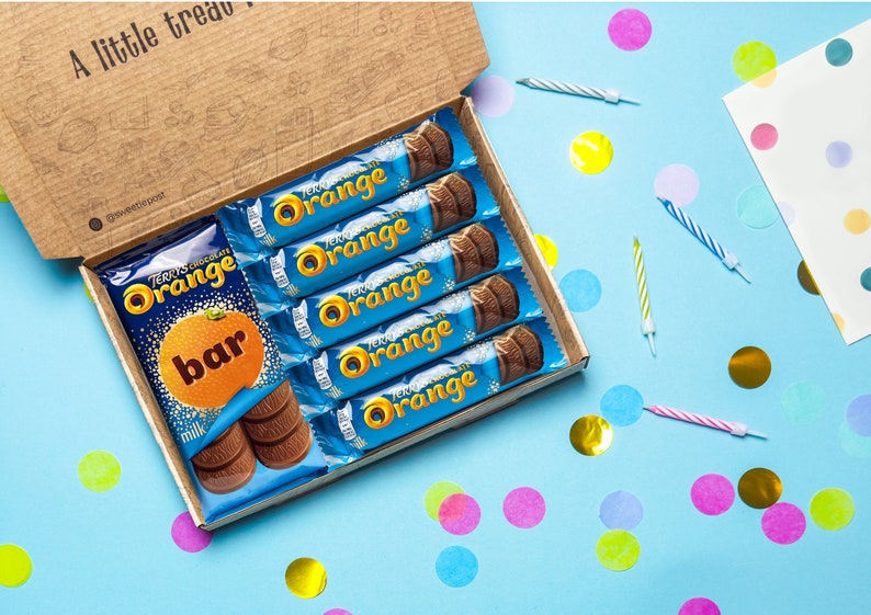 A SweetiePost Gift Box filled with Terry's chocolate orange, including the medium and individual bars. The A5 Terry's chocolate orange hamper by SweetiePost.