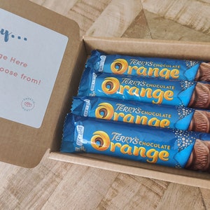 A SweetiePost Gift Box filled with Terry's chocolate orange. The A6Terry's chocolate orange hamper by SweetiePost.