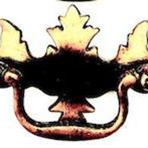 May include: Antique brass cabinet pull with a decorative leaf design. The pull has a curved shape and a flat base.