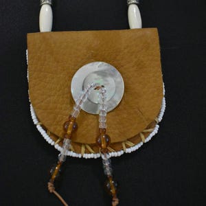 Native american medicine pouch with natural seashell buttons