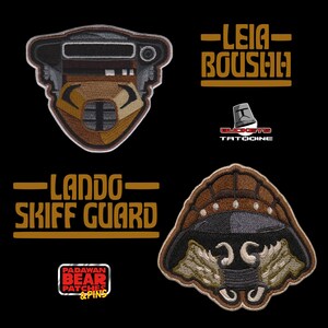 May include: Two embroidered patches featuring character helmets. One patch depicts a brown and black Boushh helmet with the text LEIA BOUSHH. The other patch shows a brown and black Lando Skiff Guard helmet with the text LANDO SKIFF GUARD. Logos for Buckets Tatooine and Padawan Bear Patches & Pins are included.