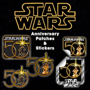 May include: A collection of Star Wars 50th anniversary patches and stickers featuring a gold number 50 with a starburst icon above two figures. The design includes the Star Wars logo in yellow and white text against a black background with stars.