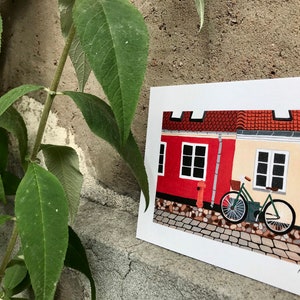 Carte A5 / Ribe, Danemark / carte postale d’un vélo contre une façade du village de Ribe au Danemark