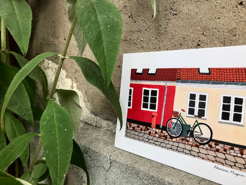 Mapa A5 / Ribe, Dinamarca / postal de una bicicleta contra una fachada del pueblo de Ribe en Dinamarca imagen 1