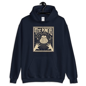 May include: Navy blue hoodie featuring a vintage-style graphic of a knob with the text "THE KNOB" above it.