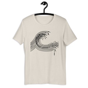May include: A beige t-shirt with a black graphic of a wave made of audio cables.