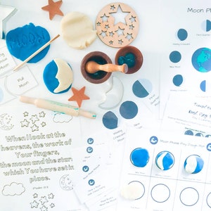 May include: A set of printable moon phase learning materials for kids. The set includes a play dough mat, a printable worksheet with a moon phases chart, and a printable worksheet with a verse from Psalm 83. The materials are designed to help children learn about the different phases of the moon.
