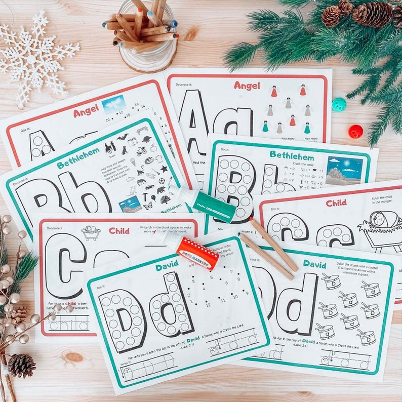 May include: A set of six printable Christmas-themed educational activity sheets for children. Each sheet features a different letter of the alphabet, a word, and a picture. The sheets are designed to help children learn about the Christmas story and practice their letter recognition and counting skills.