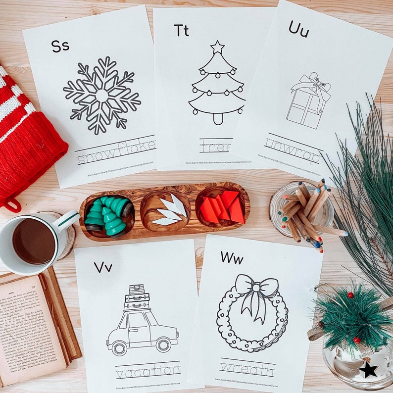 May include: Five black and white printable coloring pages with Christmas-themed illustrations and the letters "Ss", "Tt", "Uu", "Vv", and "Ww" at the top of each page. The words "snowflake", "tree", "unwrap", "vacation", and "wreath" are written below each image.