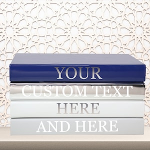Kyss Studio - Glam your bookshelf or coffee table with luxury designer books.  Stack them up in classic style or choose the color that will take your room  to new heights of