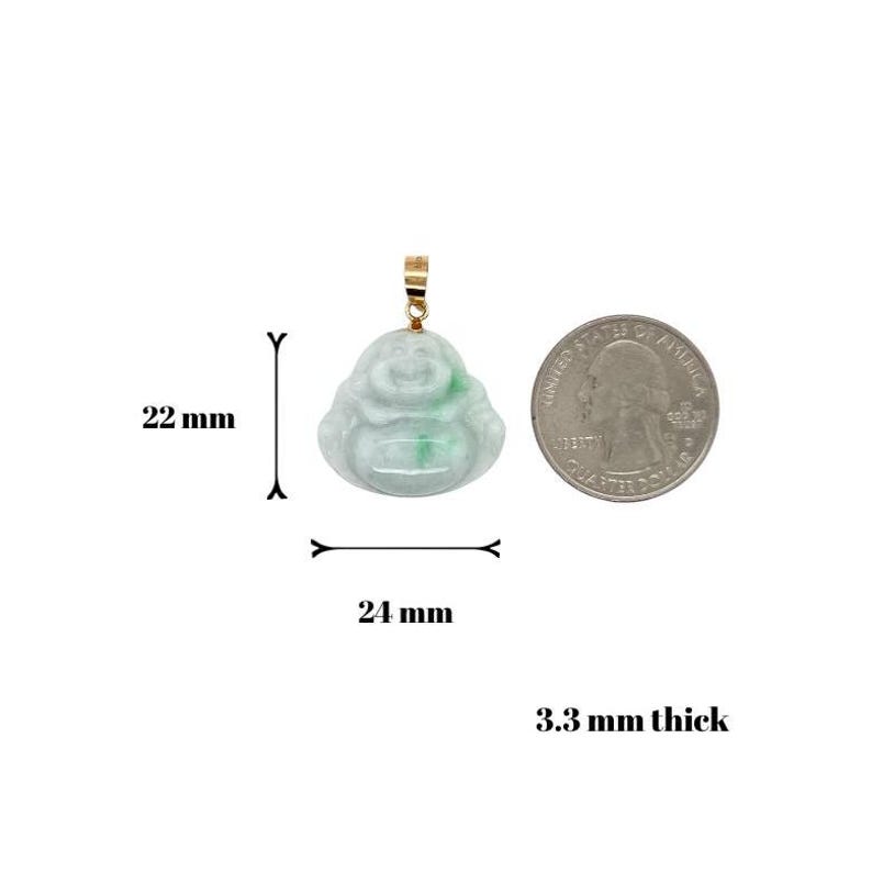 May include: Green jade Buddha pendant with a gold bail. The pendant is 22 mm wide, 24 mm tall, and 3.3 mm thick.