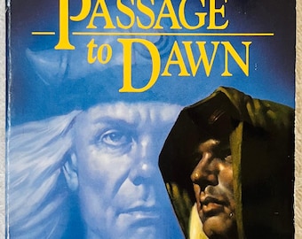 May include: A paperback book titled Passage to Dawn by R.A. Salvatore, part of the Forgotten Realms series. The cover features a large, ghostly blue face of a long-haired figure behind a smaller, detailed portrait of a hooded character in profile.