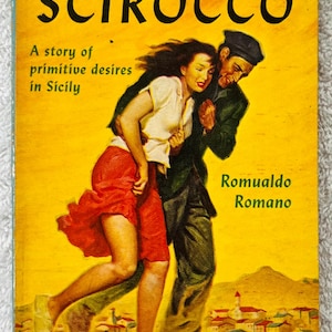 May include: Vintage paperback book cover with the title "SCIROCCO" in large black letters. The cover features an illustration of a man and woman embracing, set against a yellow background. Text includes "A story of primitive desires in Sicily."