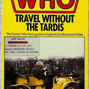 May include: A paperback book titled Doctor Who: Travel Without The Tardis, The Doctor Who fan's guide to England, Scotland and Wales by Jean Airey and Laurie Haldeman. The cover features a yellow vintage car and a road sign.