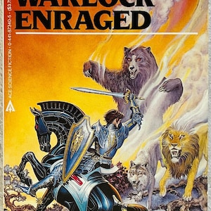 May include: A paperback book titled The Warlock Enraged by Christopher Stasheff. The cover art depicts a knight in blue armor on a black horse, wielding a sword and shield, facing a large brown bear, a lion, and a wolf against a yellow background.