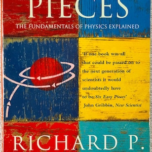 May include: A book titled Six Easy Pieces: The Fundamentals of Physics Explained by Richard P. Feynman. The cover features a grid of red, blue, and yellow distressed wood textures, a red sphere with white orbital lines, and a quote by John Gribbin.