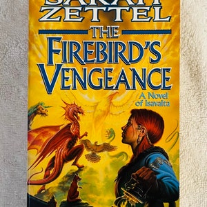 May include: A paperback book titled "The Firebird's Vengeance" by Sarah Zettel. The cover shows a woman, dragons, and other fantasy creatures against a yellow and blue background. The book is a novel of Isavalta.