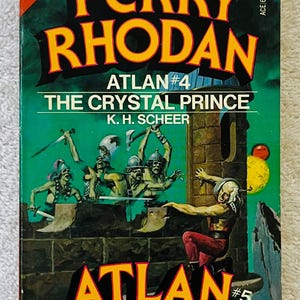 May include: A vintage paperback book cover for "Perry Rhodan" with a striking illustration. The cover displays the title in bold yellow letters, with the sub-title "Atlan #4 The Crystal Prince" and "Atlan #5 War of the Ghosts". The artwork depicts science fiction characters.