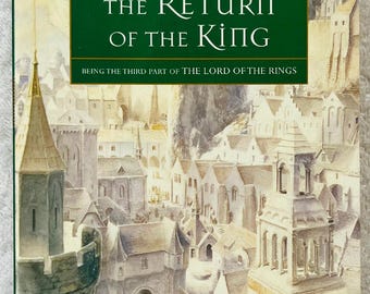 May include: Book cover of "The Return of the King" by J.R.R. Tolkien. The cover shows a detailed illustration of a medieval city with towers and buildings. The title is in large white letters on a green background.