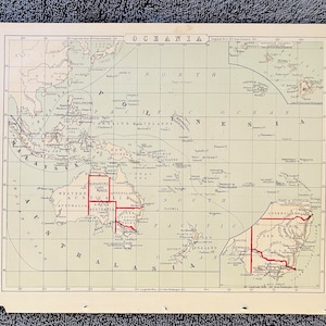 May include: A vintage map of Oceania, featuring detailed geographical information. The map is printed on aged paper and includes the names of countries, islands, and bodies of water. Red lines highlight specific regions, with the word "OCEANIA" at the top.