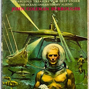 May include: Vintage paperback book cover titled "Treasure of the Black Falcon." The cover art depicts a diver holding a statue underwater, with a sunken ship and alien spacecraft in the background. The author's name is John Coleman Burroughs.