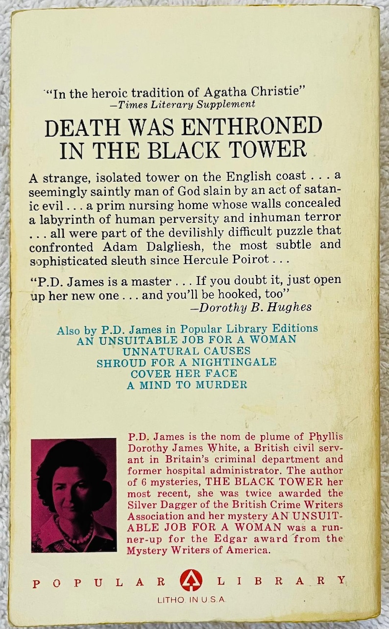May include: A vintage paperback book titled "Death Was Enthroned in the Black Tower" by P.D. James. The cover features text and a portrait of the author. Published by Popular Library.