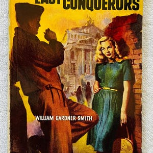May include: Vintage paperback book cover for "Last of the Conquerors" by William Gardner Smith. The cover features a couple in front of a building, with the title in large yellow letters. The book is a Signet Books special edition.