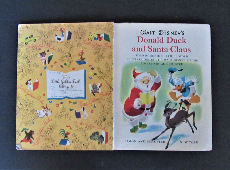 May include: A vintage Little Golden Book featuring Donald Duck and Santa Claus. The cover shows Donald Duck in a blue shirt and Santa Claus in a red suit. The book is titled "Walt Disney's Donald Duck and Santa Claus".