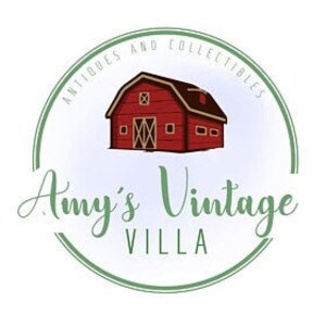 May include: A red barn with white windows and a white roof, surrounded by a blue and green circle with the text "Antiques and Collectibles Amy's Vintage Villa".