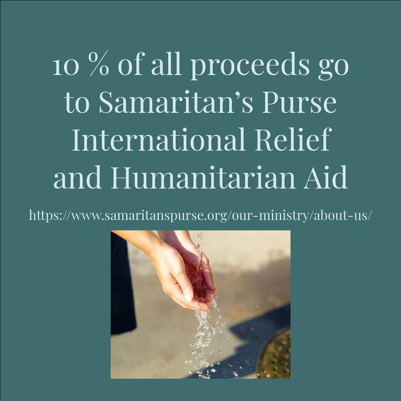 May include: A pair of hands cupped together, catching water flowing from a fountain. The text "10% of all proceeds go to Samaritan's Purse International Relief and Humanitarian Aid" is displayed above the image. The website address "https://www.samaritanspurse.org/our-ministry/about-us/" is displayed below the image.