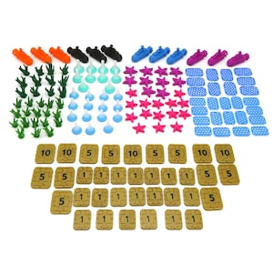 May include: A set of game pieces for a board game. The pieces include submarines, starfish, trees, test tubes, and tiles with numbers 1, 5, and 10.