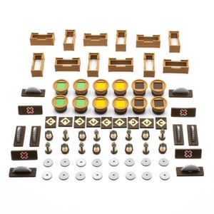May include: A set of wooden game pieces for a board game. The set includes brown wooden boxes, green, yellow, and red circular pieces, brown wooden lanterns, and saw blades.