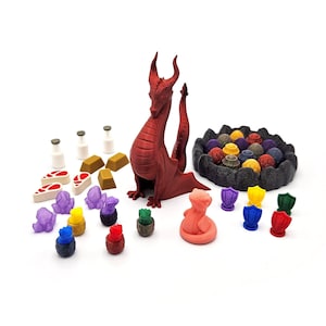 May include: A red dragon figurine with a curled tail, surrounded by colorful miniature figurines, gold bars, and a black and gray stone base with colorful gems.