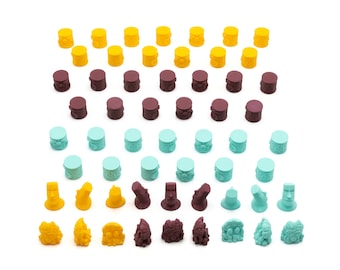 May include: A collection of colorful game pieces with different designs. The pieces are made of plastic and have a variety of colors, including yellow, brown, and blue. The pieces are arranged in a grid pattern.